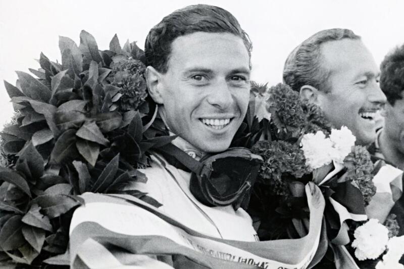 Jim Clark celebrates his triumph with Lotus Type 38